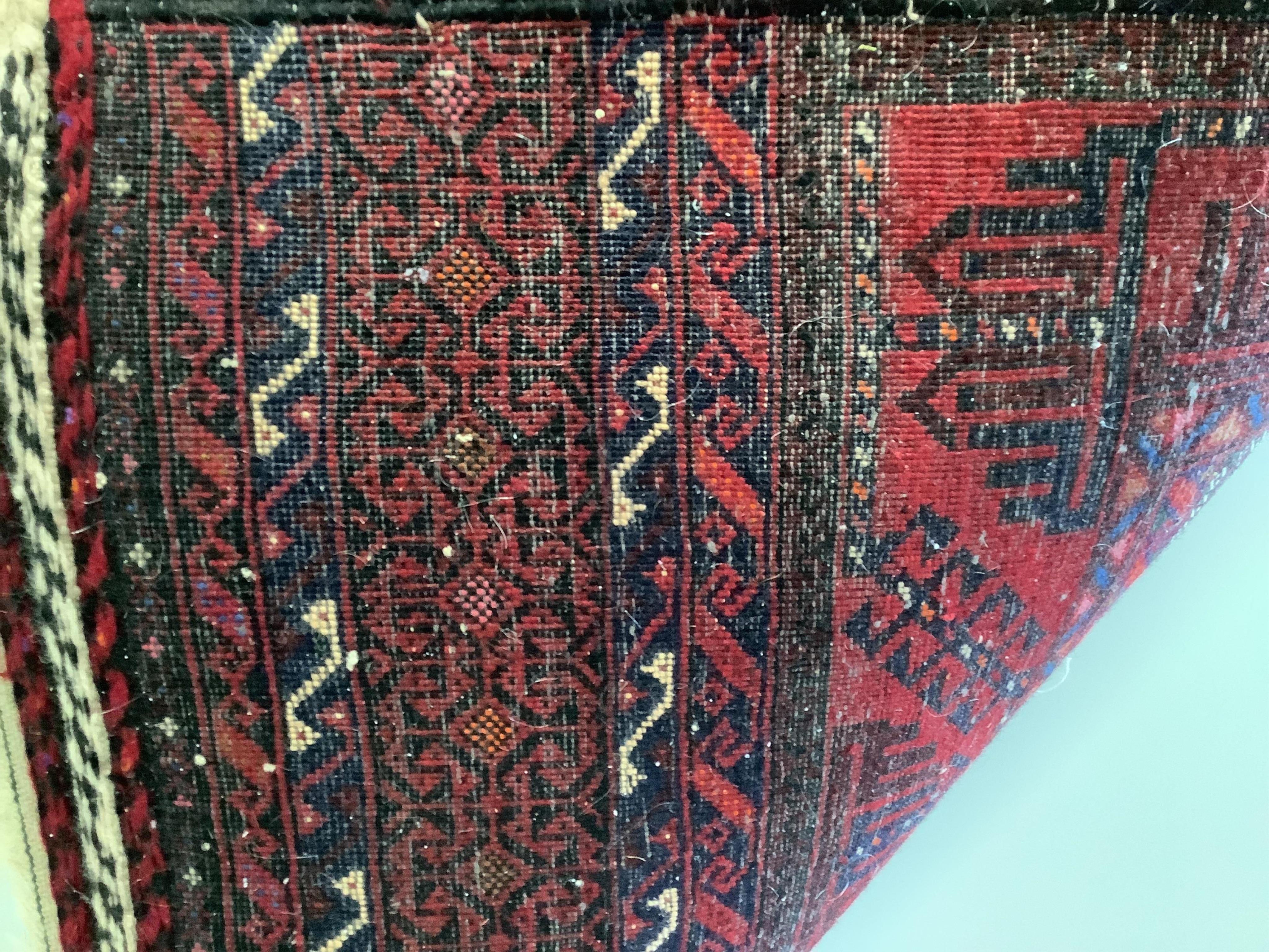 An Afghan rug, 164 x 82cm. Condition - fair